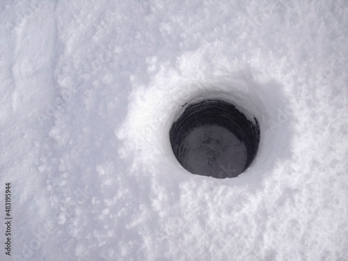 Ice fishing on a lake in Orangeville photo