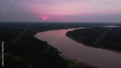 Amazon sunset rainforest in peru photo