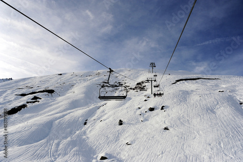 Empty chair lifts on a ski resort in winter