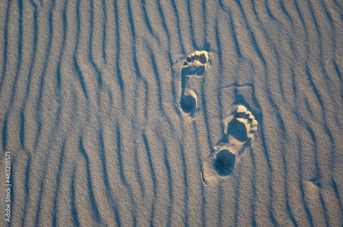 Foot steps on the sand