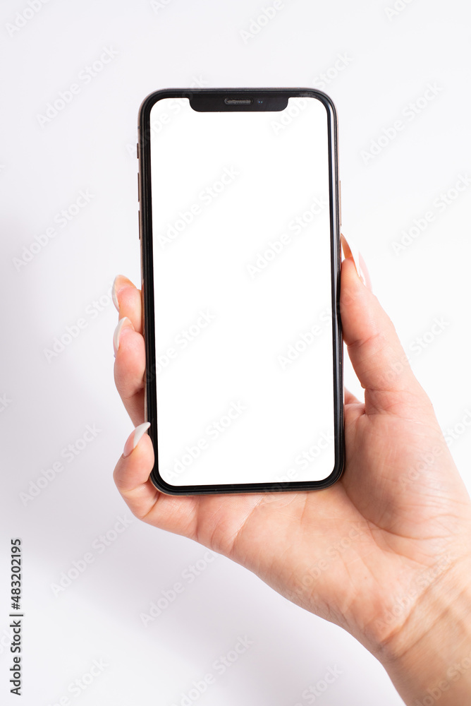 Mobile phone with blank white screen held in one hand on white background