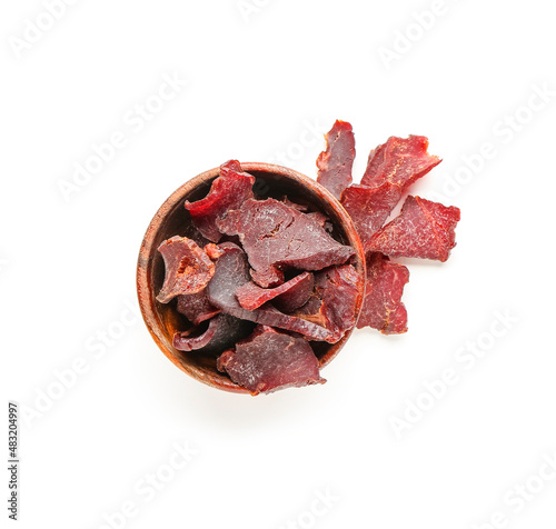 Cuadro en lienzo Bowl with spicy beef jerky on white background