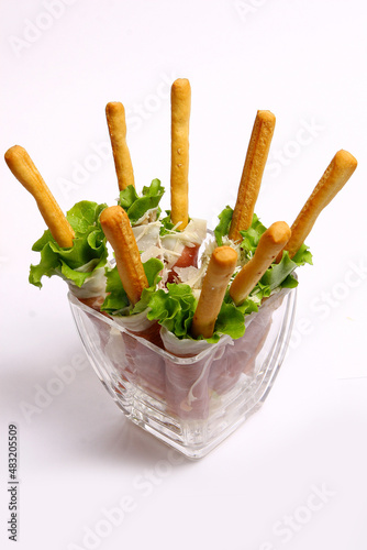 Fresh delicious salads on white background