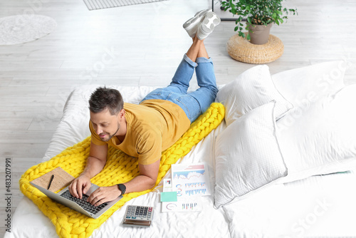 Young man working remotely ...