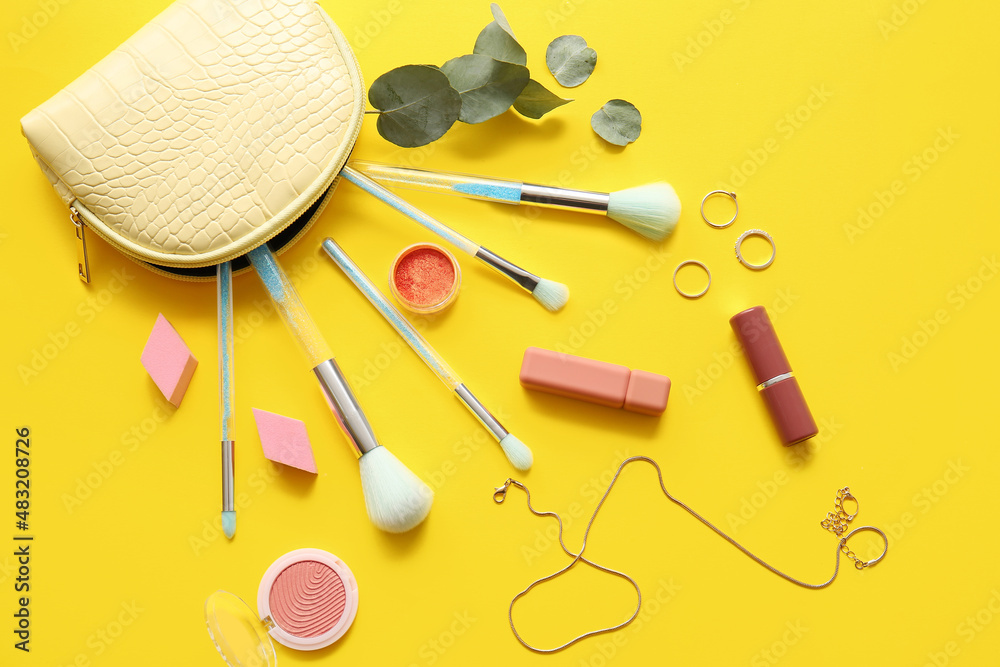 Decorative cosmetics on yellow background Decorative cosmetics on yellow background