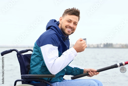 Smiling man in wheelchair f...