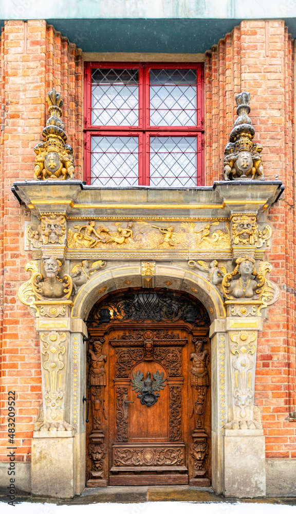 Antique carved wooden door of luxury gothic mansion