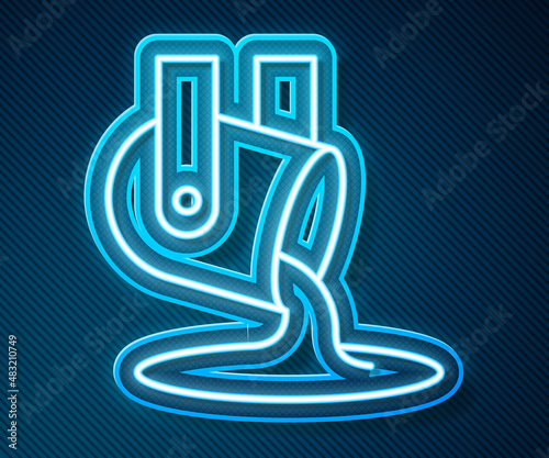 Glowing neon line Molten gold being poured icon isolated on blue background. Molten metal poured from ladle. Vector