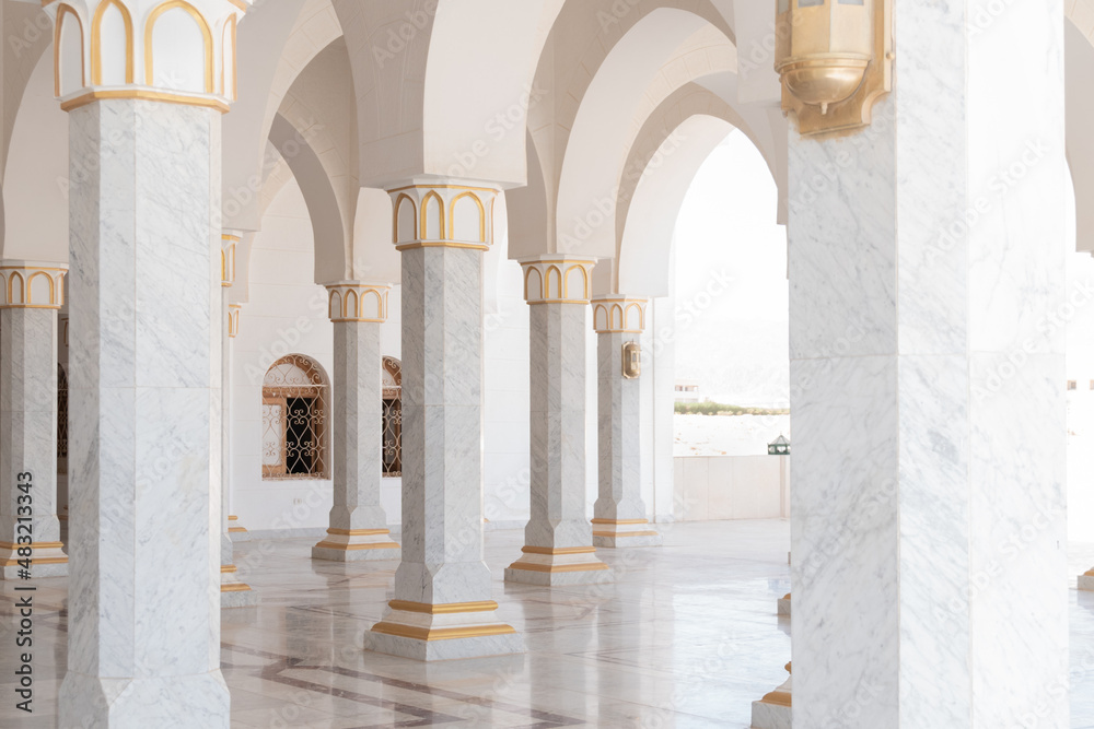 Portico of El Salam Mosque with white columns and arches. Sharm el Sheikh, Egypt.