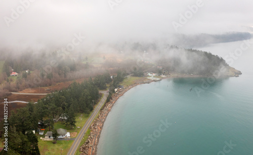 West Side Lummi Island, Washington. Fog envelops Legoe Bay and the coastline of Lummi island and Lover's Bluff.
