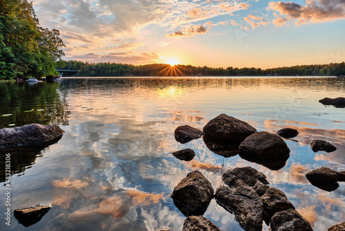 Sunset  over the lake whit rocks 