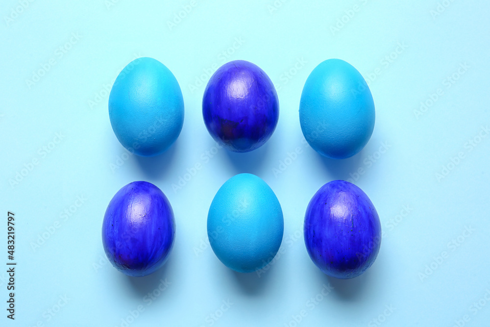 Blue painted Easter eggs on color background Blue painted Easter eggs on color background