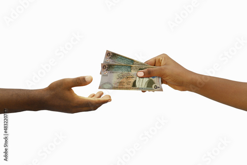 Hand giving 3D rendered 50 Jordanian dinar notes to another hand. Hand receiving money photo