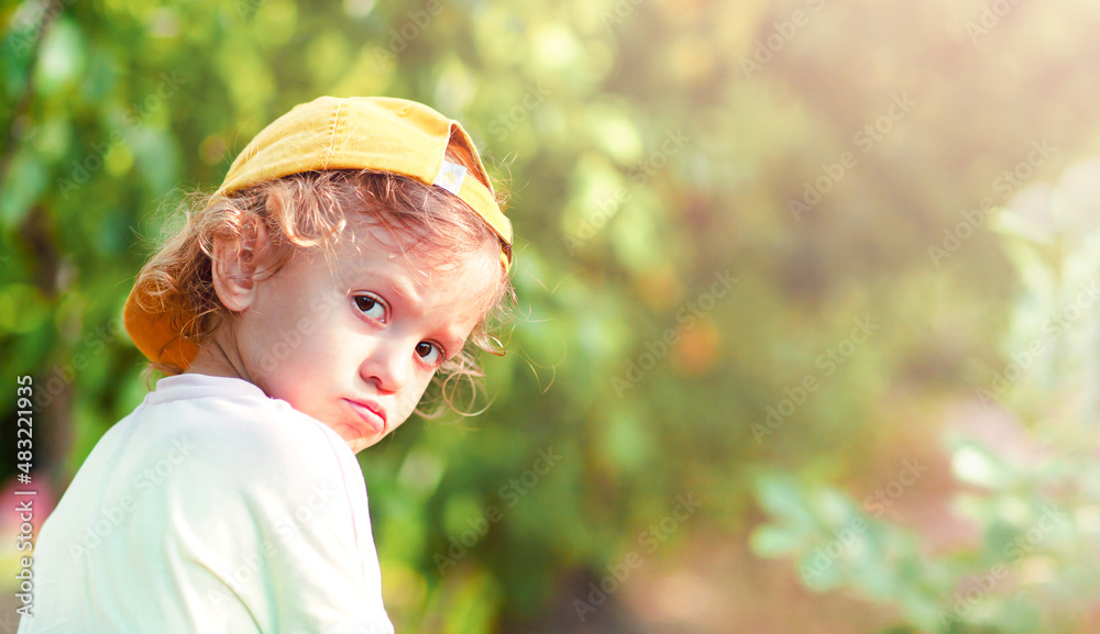 the offended child looked around with pouting lips the offended child looked around with pouting lips