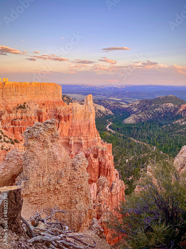 The bright orange sun sets on the orange granite Hoodoos in Bryce Canyon National Park. Warming the rock formations and bringing intense color to these beautiful natural landscape images