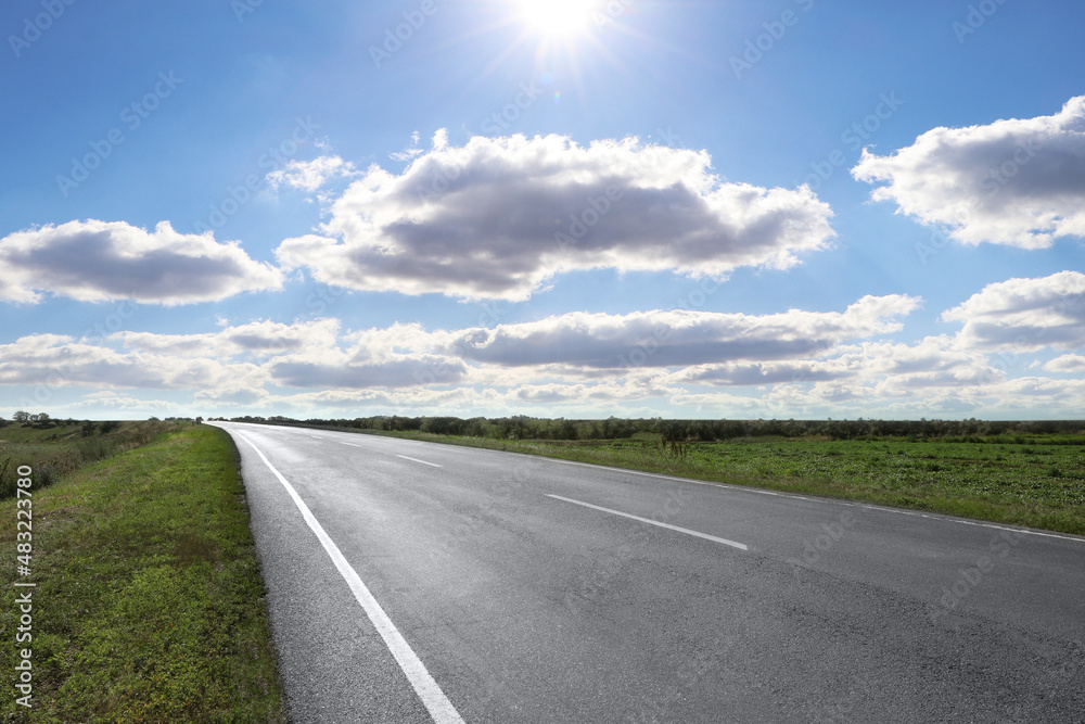 View of empty asphalt road on sunny day View of empty asphalt road on sunny day