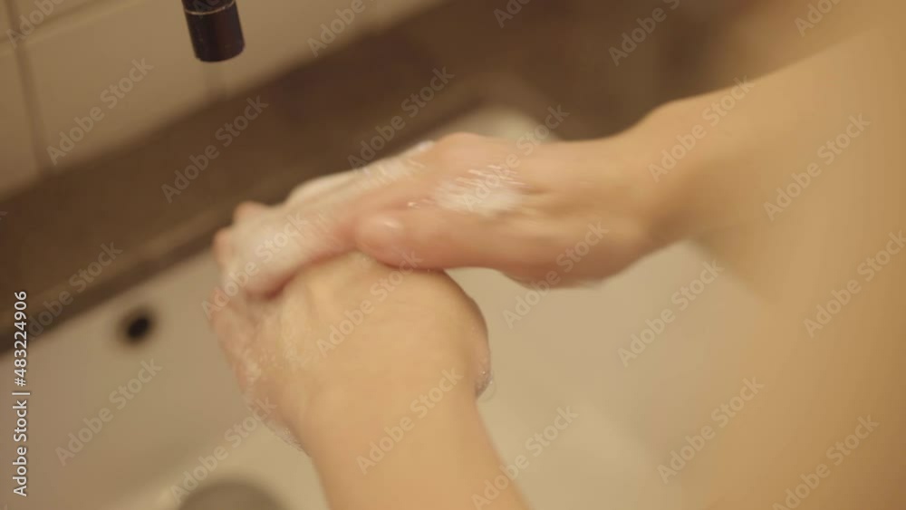 Woman developed to wash frequent her hands with soap to prevent spreading Covid-19. Close-up shot Woman developed to wash frequent her hands with soap to prevent spreading Covid-19. Close-up shot