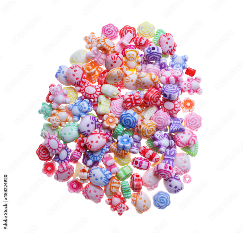 Pile of cute colorful ceramic beads on white background, top view
