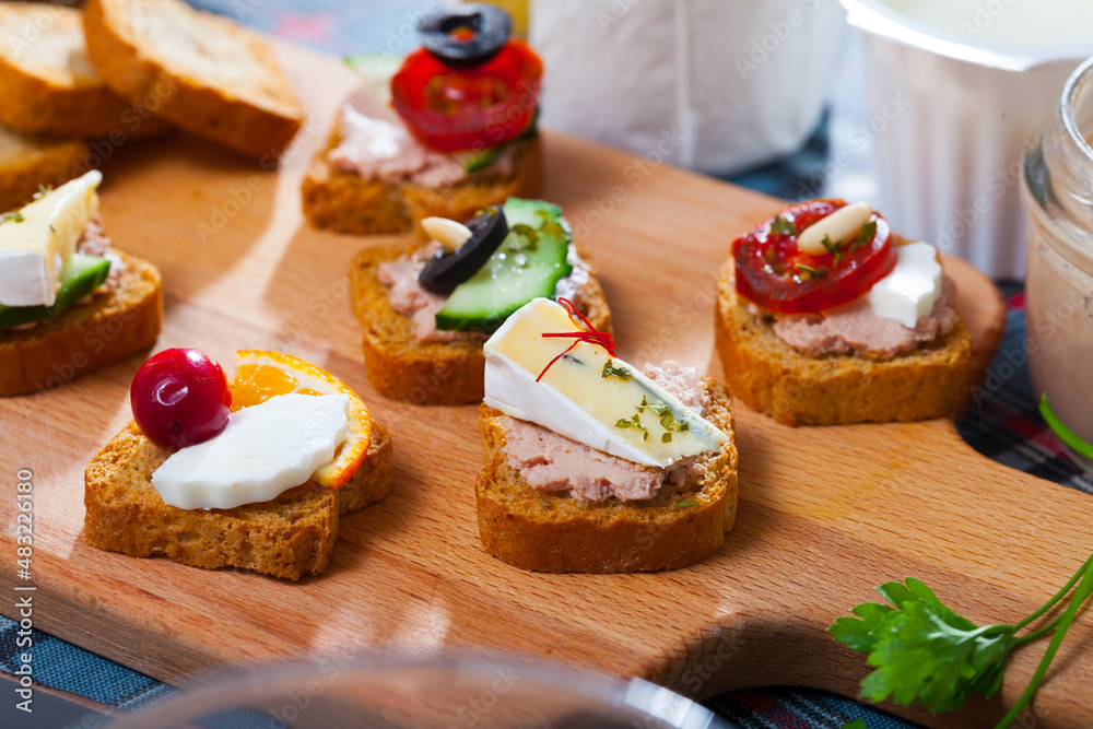 Set of various mini appetizers with vegetable, cheese and meat pate filling