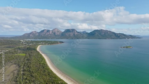 Wallpaper Mural 4k high angle aerial drone footage and flight over Muirs Beach with Coles Bay and the famous Hazards mountain range in the background, part of Freycinet Peninsula National Park, Tasmania, Australia. Torontodigital.ca