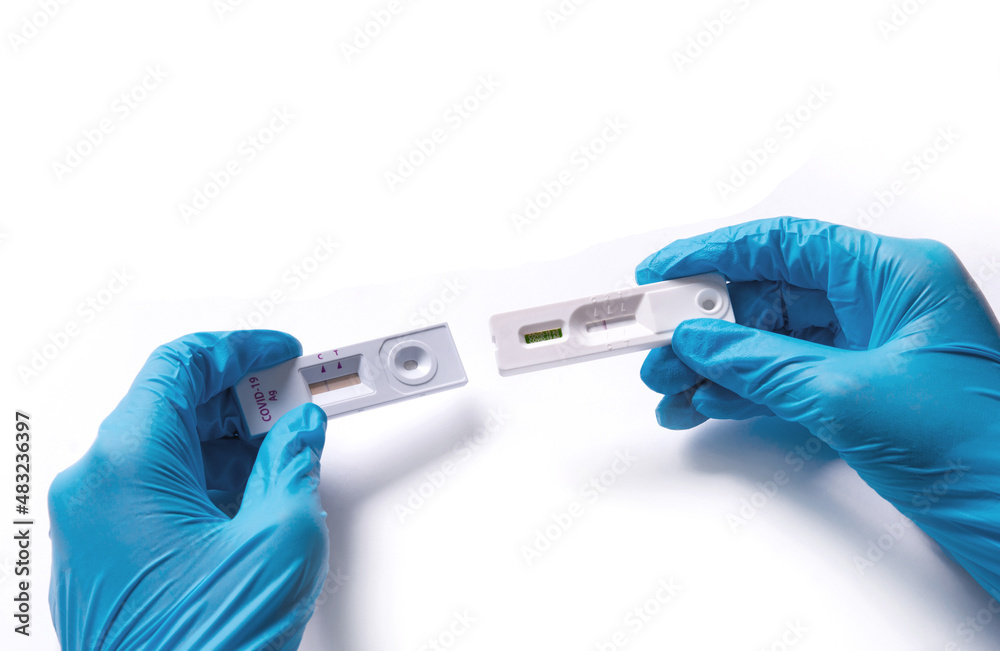 Doctor holding a COVID-19 test kit Test results are negative, not infected with coronavirus. with an antigen test kit (ATK) Doctor holding a COVID-19 test kit Test results are negative, not infected with coronavirus. with an antigen test kit (ATK)