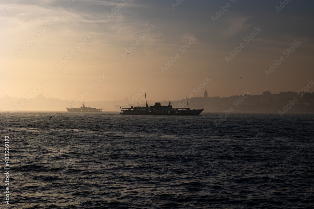 Istanbul background photo. Ferry and cityscape of Istanbul at foggy weather
