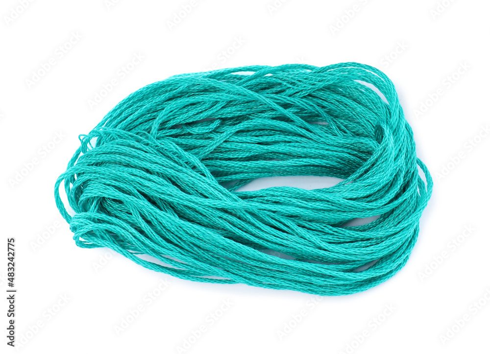 Bright turquoise embroidery thread on white background