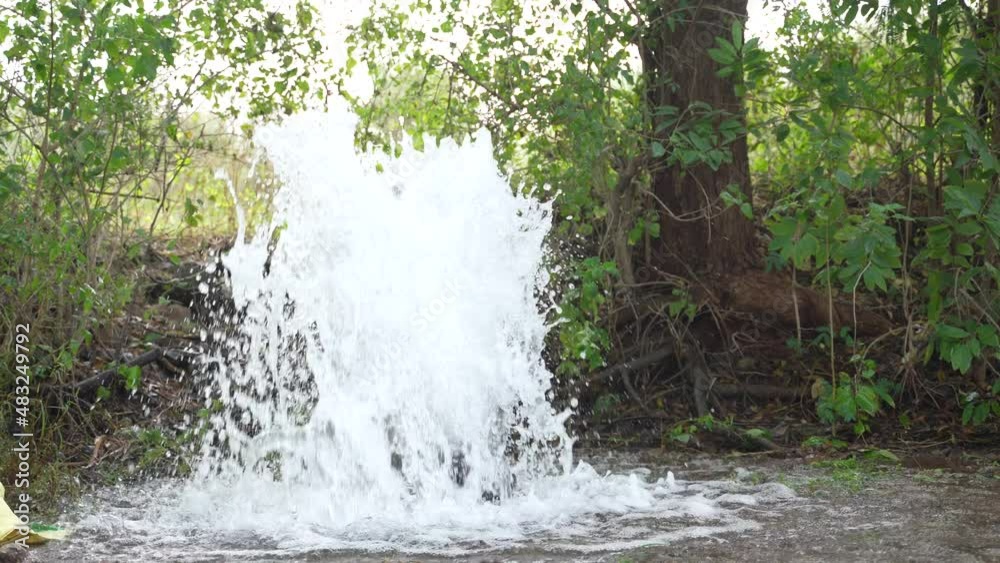 Irrigation water flow from pipe to canal for agriculture fields , slow motion water flash Irrigation water flow from pipe to canal for agriculture fields , slow motion water flash