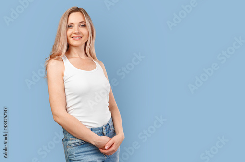 Portrait of a beautiful young woman isolated on color background