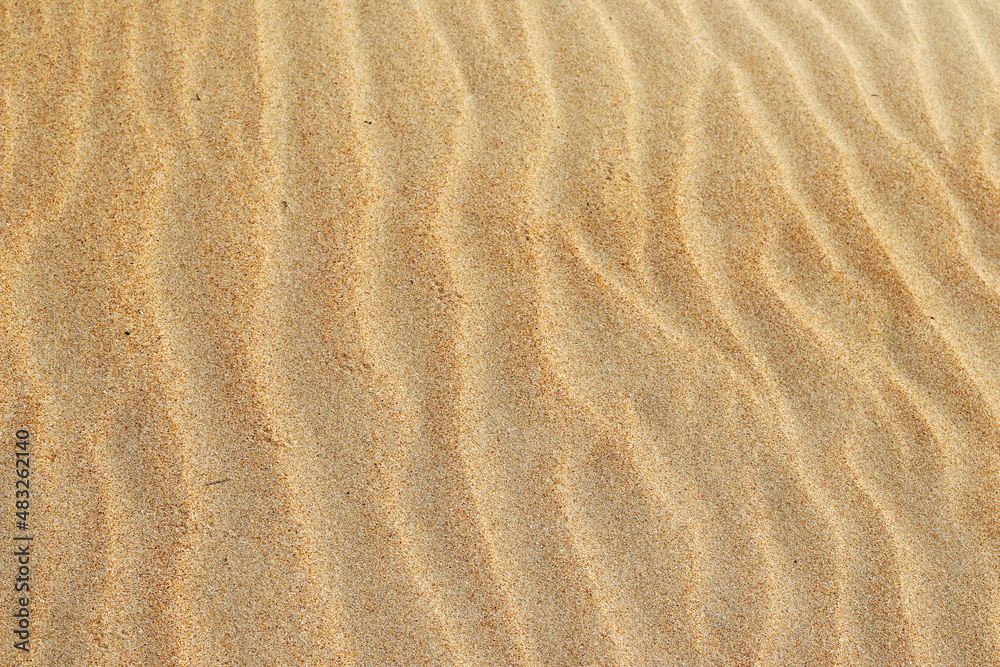 Sand texture. Sandy beach for background. Top view. Natural sand stone texture background. sand on the beach as background. Wavy sand background for summer designs. Sand texture. Sandy beach for background. Top view. Natural sand stone texture background. sand on the beach as background. Wavy sand background for summer designs.