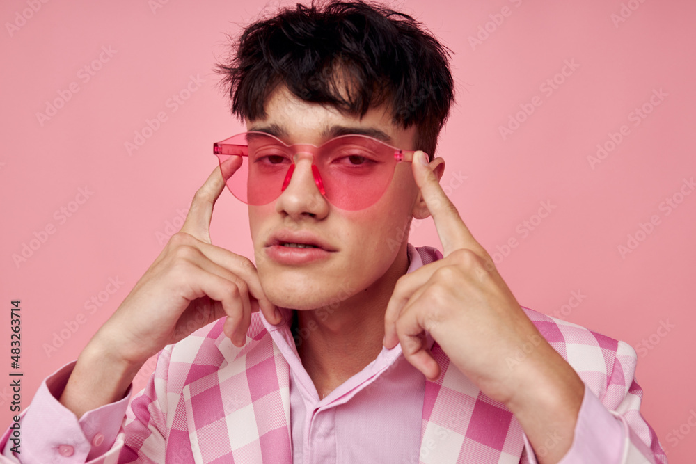 handsome guy pink glasses checkered jacket fashion posing isolated background unaltered handsome guy pink glasses checkered jacket fashion posing isolated background unaltered