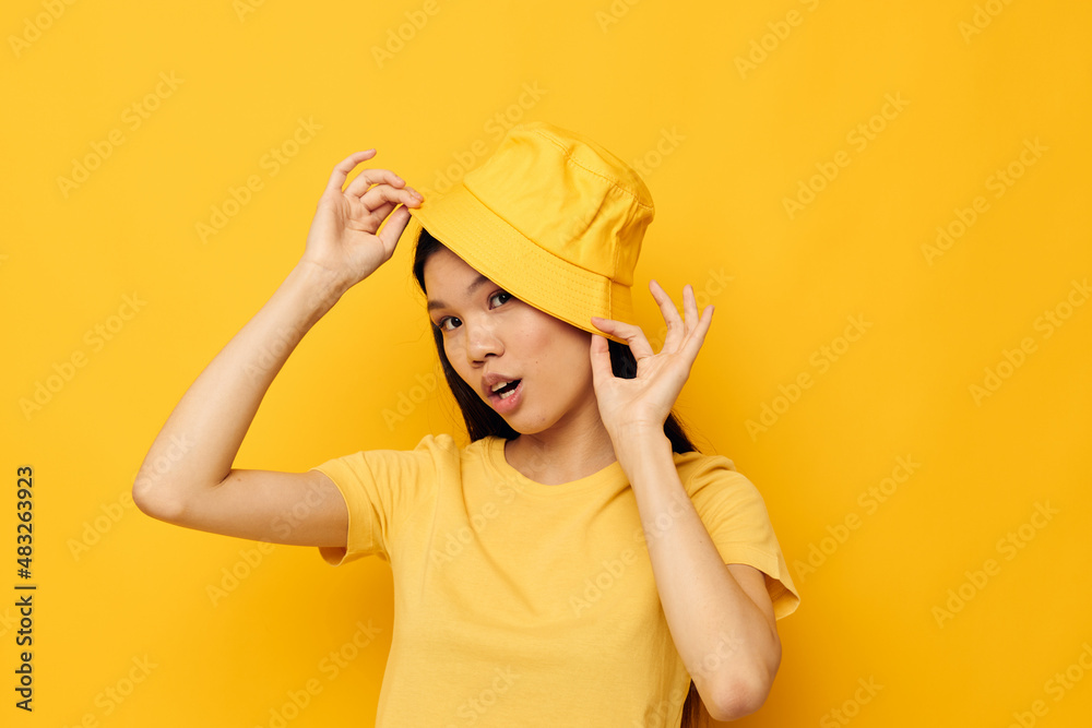 woman casual wear studio hand gesture yellow background unaltered