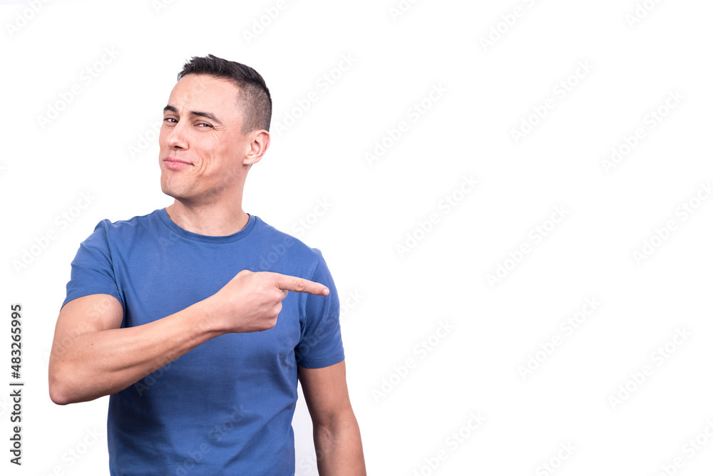 Expressive man pointing to the side with the finger Expressive man pointing to the side with the finger