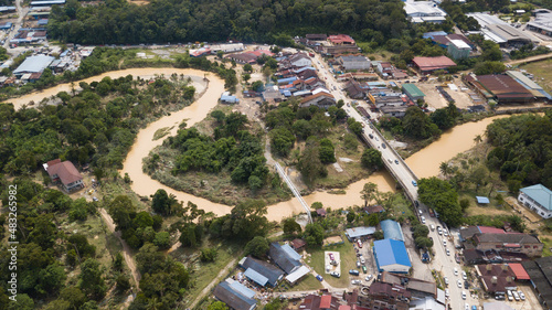 Flood situation at Hulu Langat district that causes damage of the infrastructure and housing area. Selective focus, contains dust and grain photo