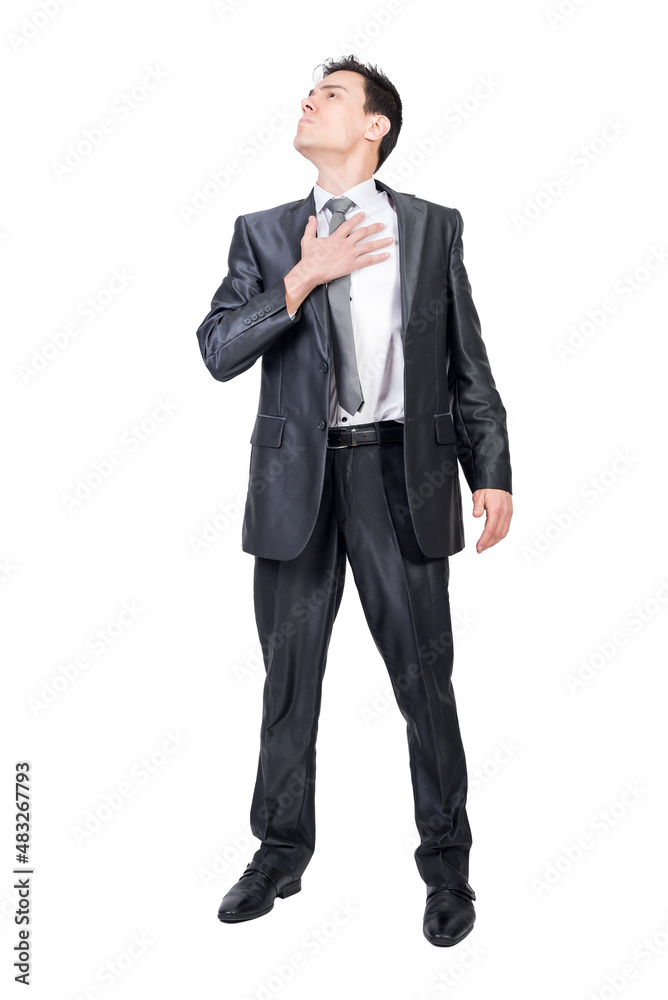 Serious man putting hand on chest and looking away Serious man putting hand on chest and looking away