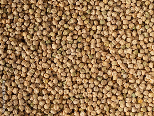 The natural food background is dried peas. Organic Dried Raw Peas as Background