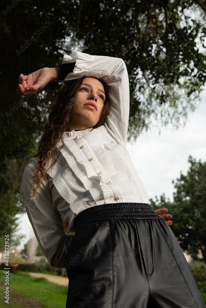 Young woman dancing outdoors. Dance performance in the street Young woman dancing outdoors. Dance performance in the street