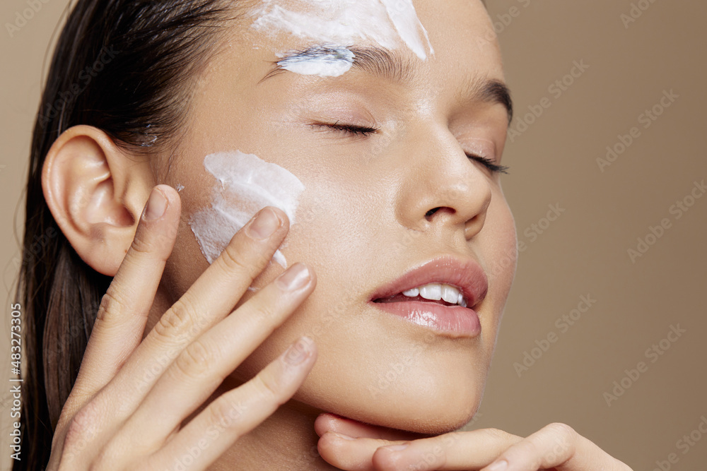 portrait woman hand near face cream rejuvenation charm isolated background