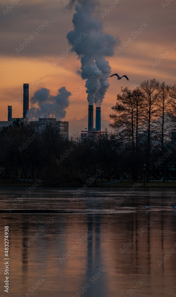 Color photograph of industrial buildings at sunset , промышленность металлургический завод рассвет дым дым выбросы смога плохая экология аэрофотосъемка