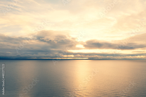 Aerial view clouds over the sea. Texture of clouds. View from above. Sunrise or sunset over clouds. Aerial ocean background