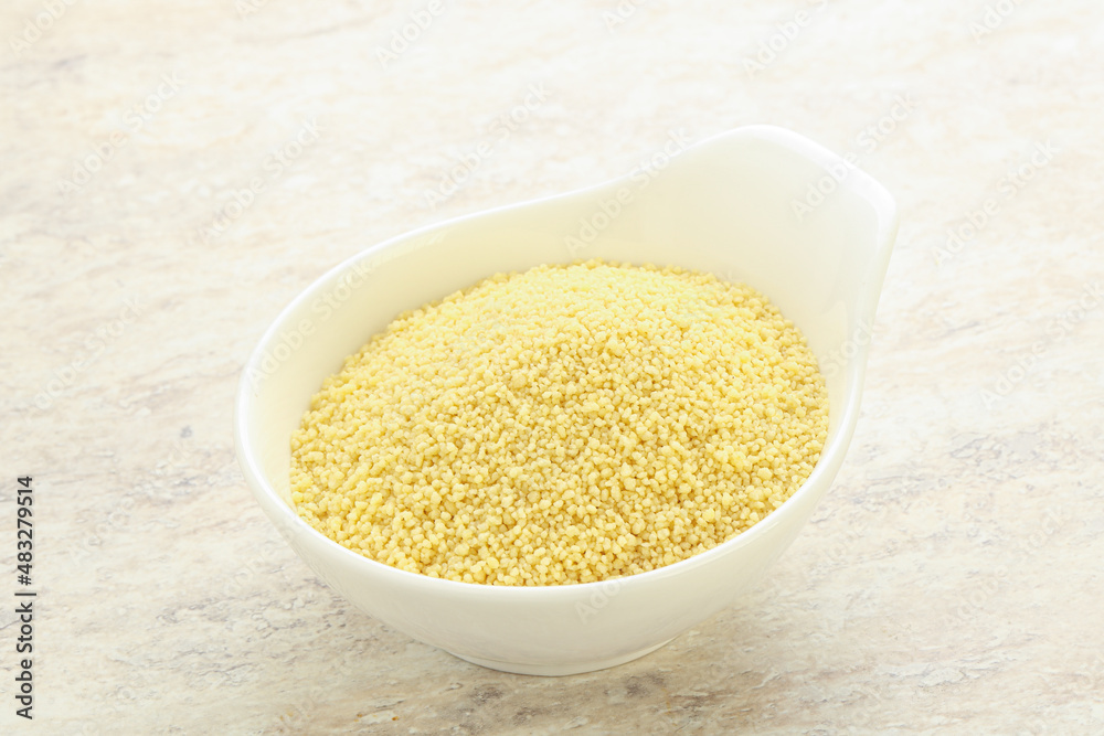 Raw couscous in the bowl Raw couscous in the bowl