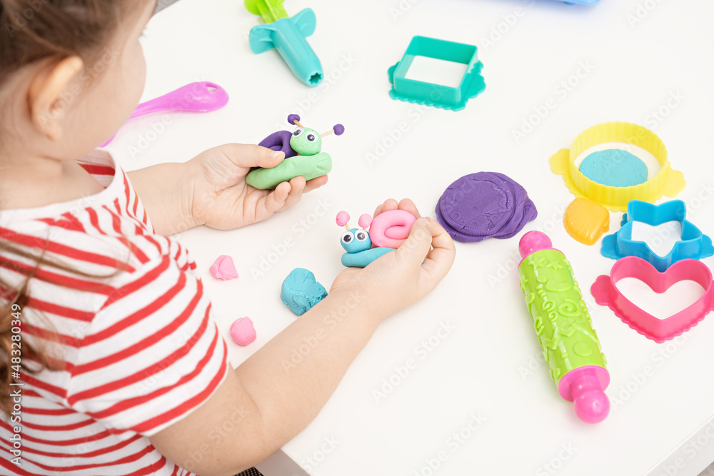 baby girl playing with plasticine, sculpting figures snails, home educational games, colorful play dough baby girl playing with plasticine, sculpting figures snails, home educational games, colorful play dough