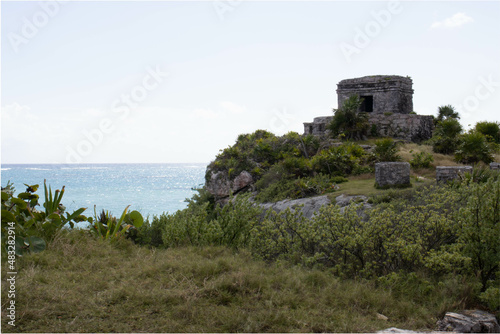 Background of a Mayan ruin of Tulum with the Caribbean Sea  this is a pre-Columbian civilization that left a great legacy of history and culture that attracts millions of tourists.