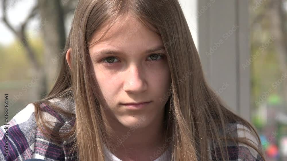 Sad Child, Unhappy Kid, Thoughtful Bullied Girl in Park, Depression of Adolescents, Children Expression in Coronavirus Pandemic Sad Child, Unhappy Kid, Thoughtful Bullied Girl in Park, Depression of Adolescents, Children Expression in Coronavirus Pandemic