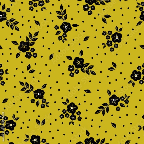 Beautiful vintage pattern. Black flowers and leaves, dots. Mustard background. Floral seamless background. An elegant template for fashionable prints.