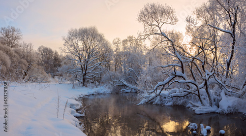 Winter frosty landscape with snow covered trees