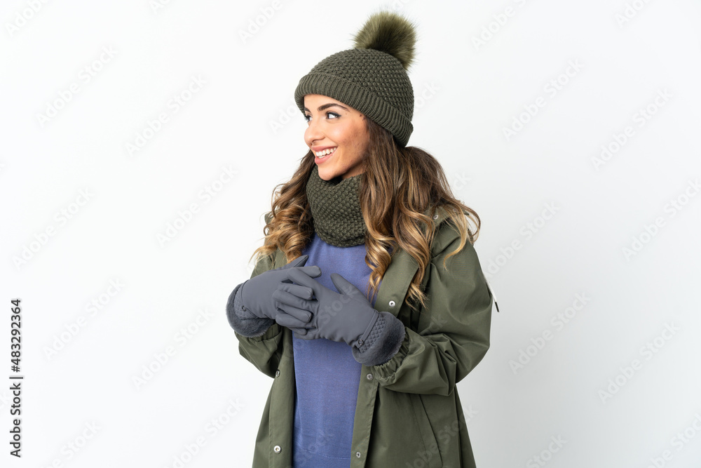 Young girl with winter hat isolated on white background looking side Young girl with winter hat isolated on white background looking side