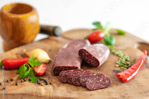Fresh meat and vegetables on wooden boards