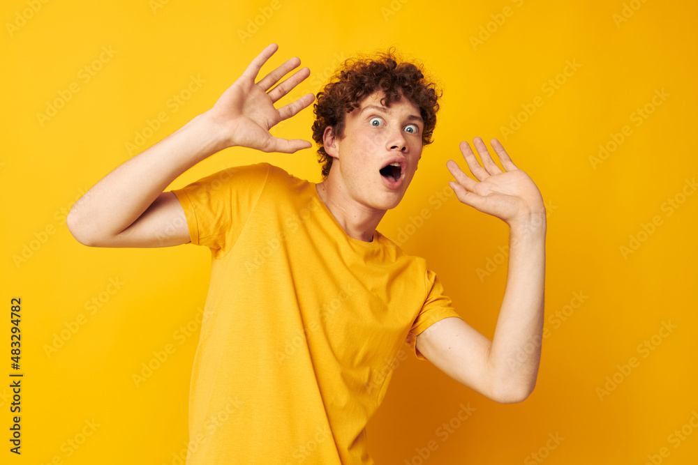 cute red-haired guy Youth style studio casual wear yellow background unaltered cute red-haired guy Youth style studio casual wear yellow background unaltered
