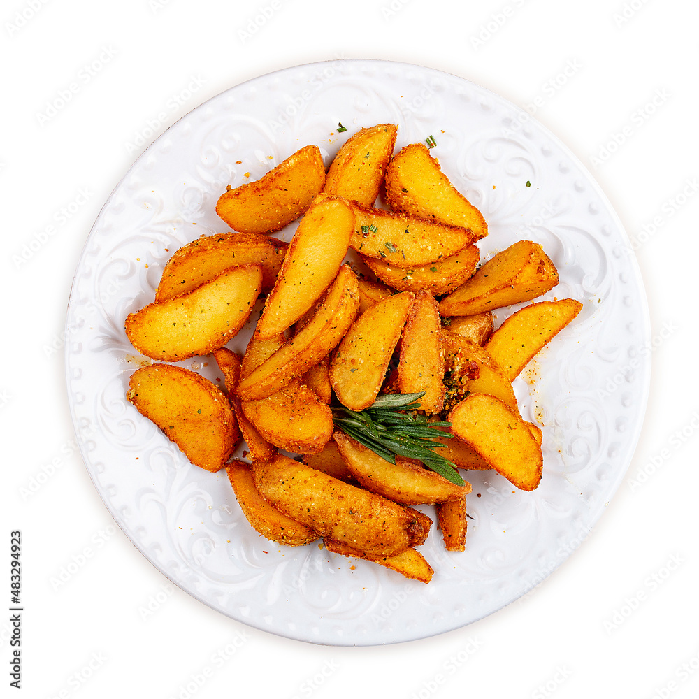Sliced fried potatoes, Creole-style with spices. On a white plate. Sliced fried potatoes, Creole-style with spices. On a white plate.